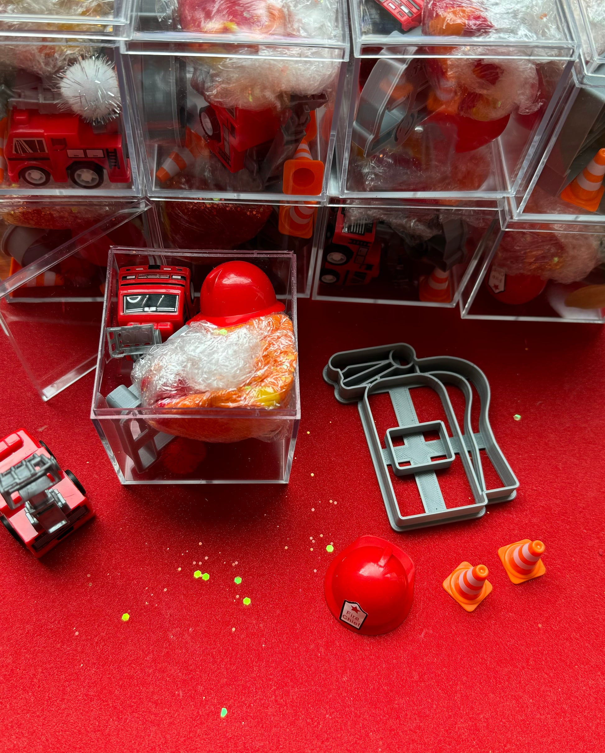 Exciting firefighter-themed sensory kit for kids aged 3 and up, including natural homemade play dough, dough molds, and miniature fire safety toys for imaginative play.
