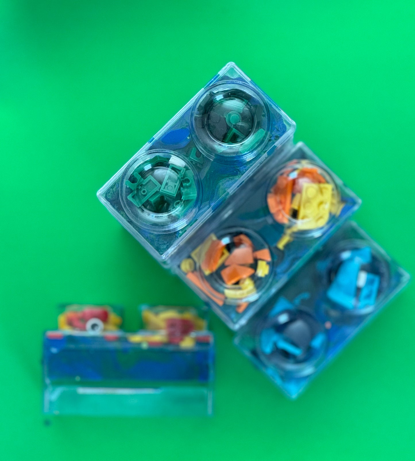 Building Block Robot Sensory Kit featuring handmade blue/green glitter dough, building blocks, and sensory toys. Designed for sensory exploration, creative play, and fine motor skill development, this kit provides a magical, hands-on experience for kids ages 3 and up.