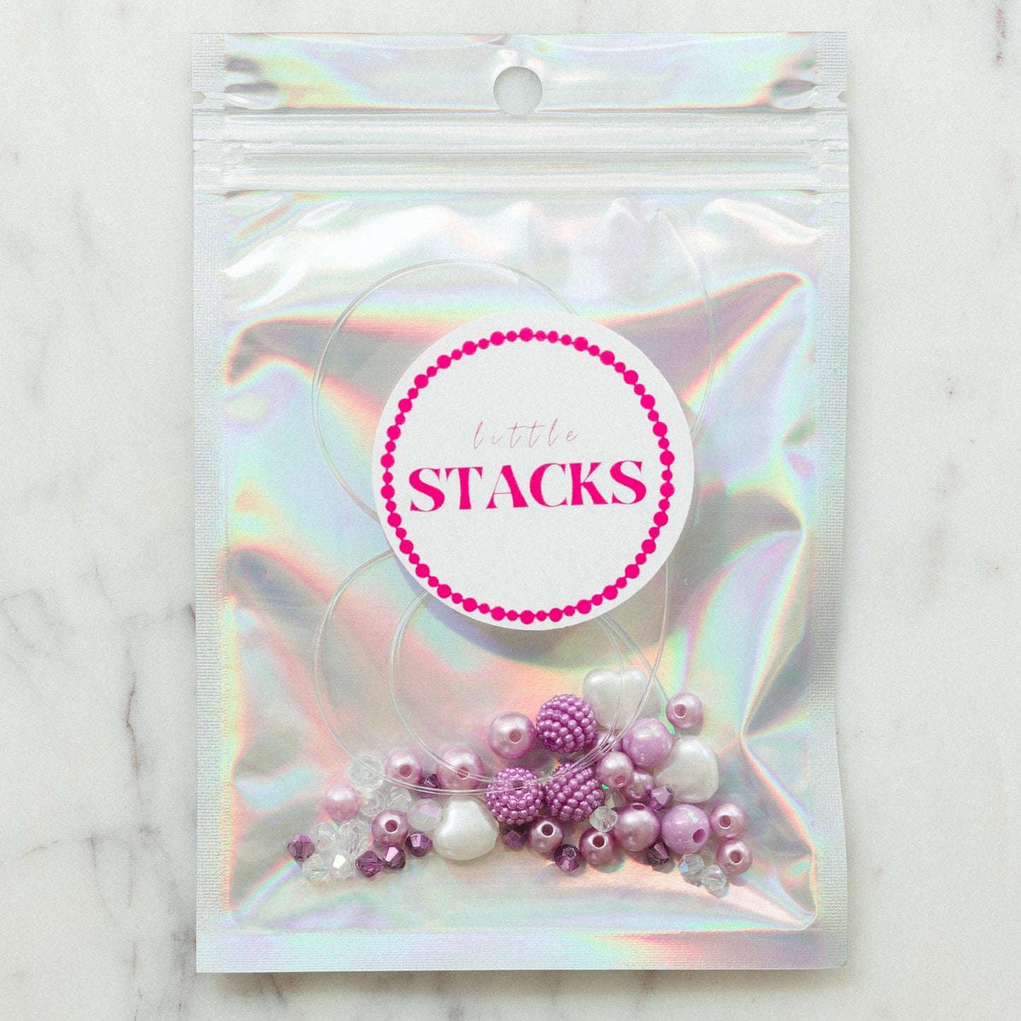SWIFTIES 'Lavender Haze' Friendship Bracelet Kit with Light Purple Pearls, Crystals, and Heart Beads, Includes Personalization for 1 Word or Name, Comes in a Silver Bag.