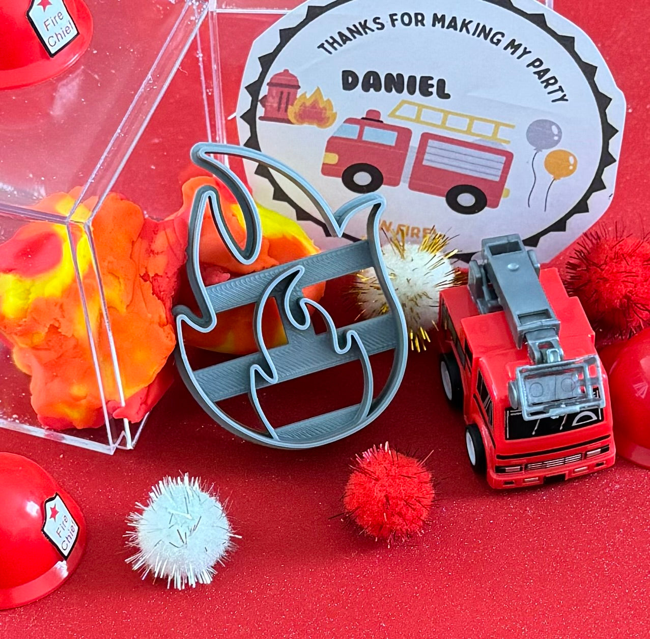Exciting firefighter-themed sensory kit for kids aged 3 and up, including natural homemade play dough, dough molds, and miniature fire safety toys for imaginative play.