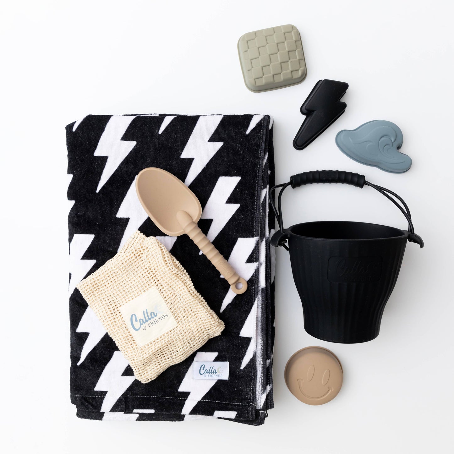 Beach towel and wet bag combo displayed on lounge chair