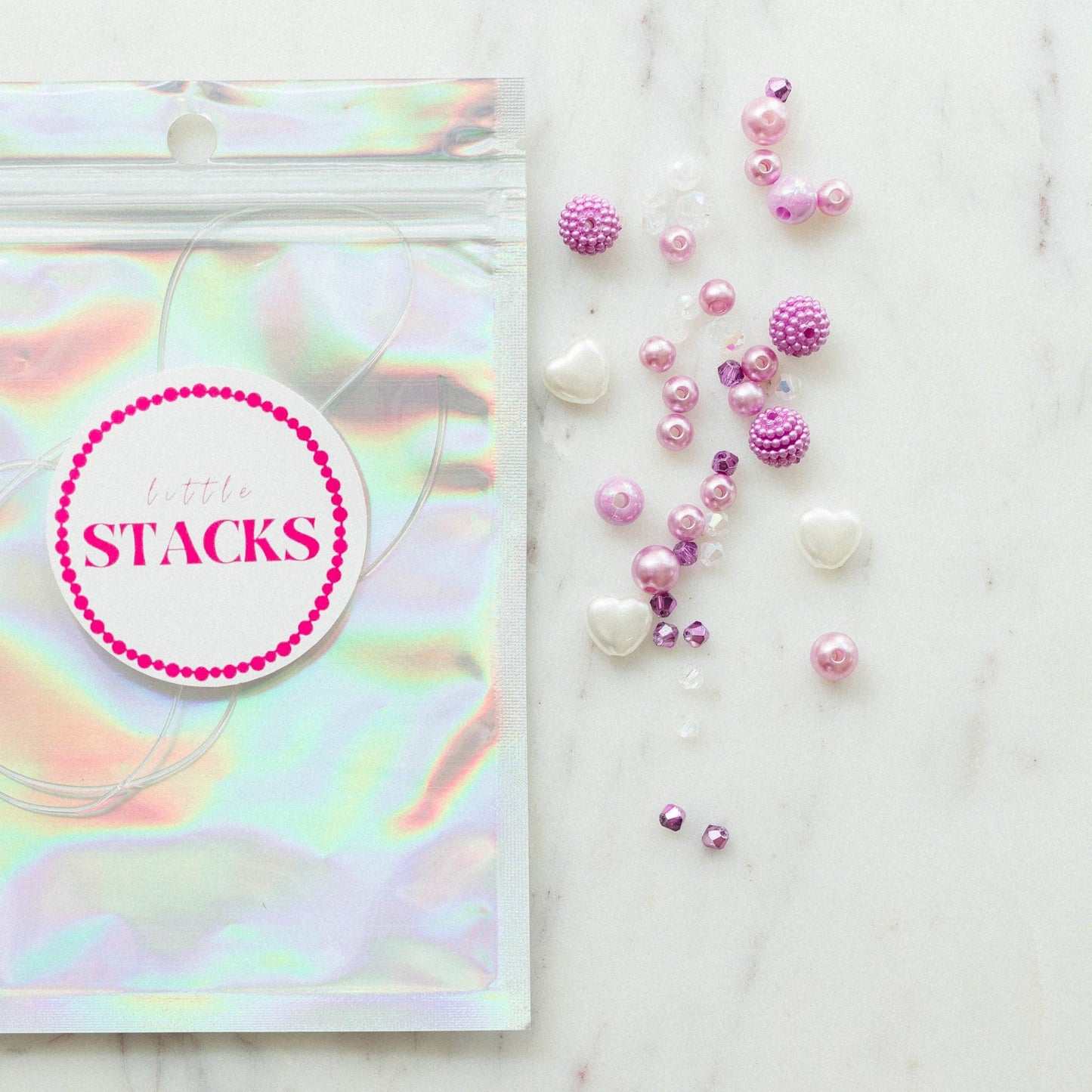 SWIFTIES 'Lavender Haze' Friendship Bracelet Kit with Light Purple Pearls, Crystals, and Heart Beads, Includes Personalization for 1 Word or Name, Comes in a Silver Bag.