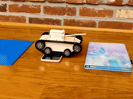 Child assembling RC tank with STEM components
