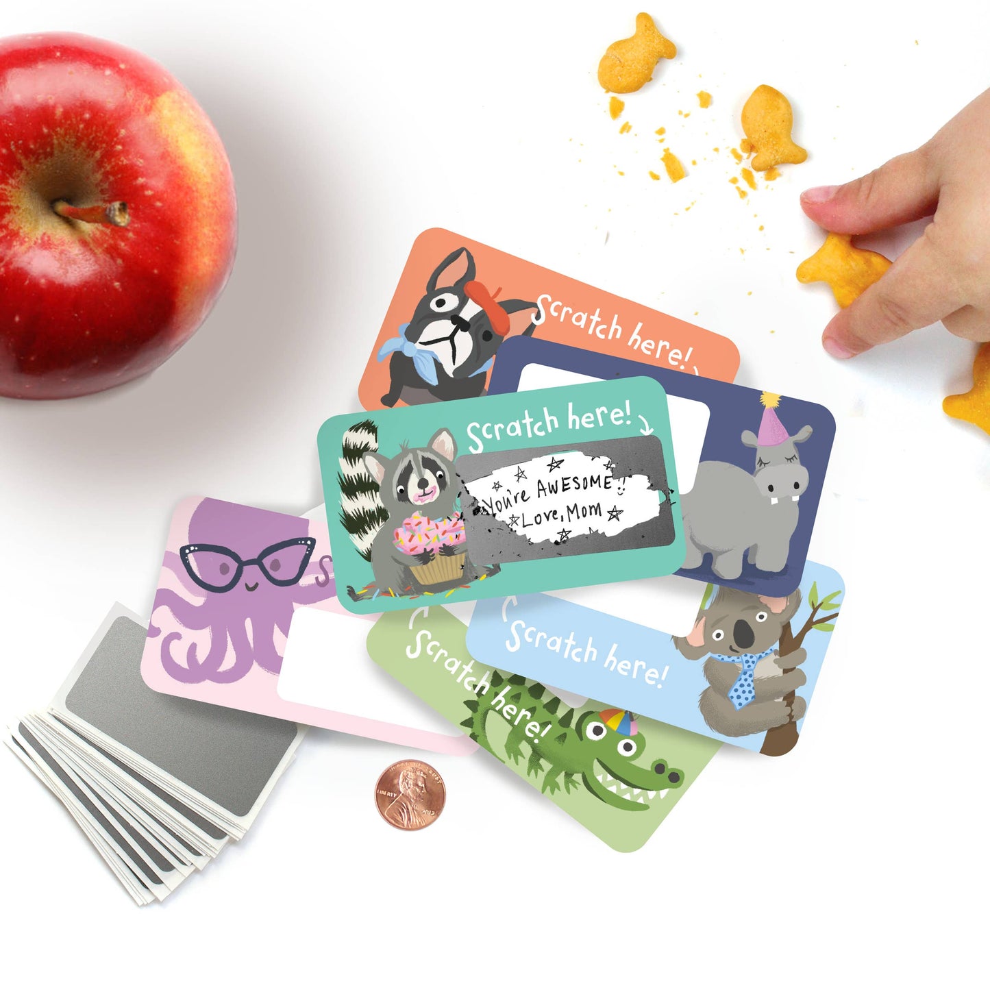 Set of 24 assorted scratch-off lunchbox notes measuring 2” x 3.5”, featuring six different animated animal friends designs. Each card allows you to write a personalized message in the blank space, which is then covered with a scratch-off sticker for a fun reveal. Perfect for slipping into lunch bags or coat pockets, these tiny notes come packaged in a clear plastic box, making them an ideal surprise for someone special.