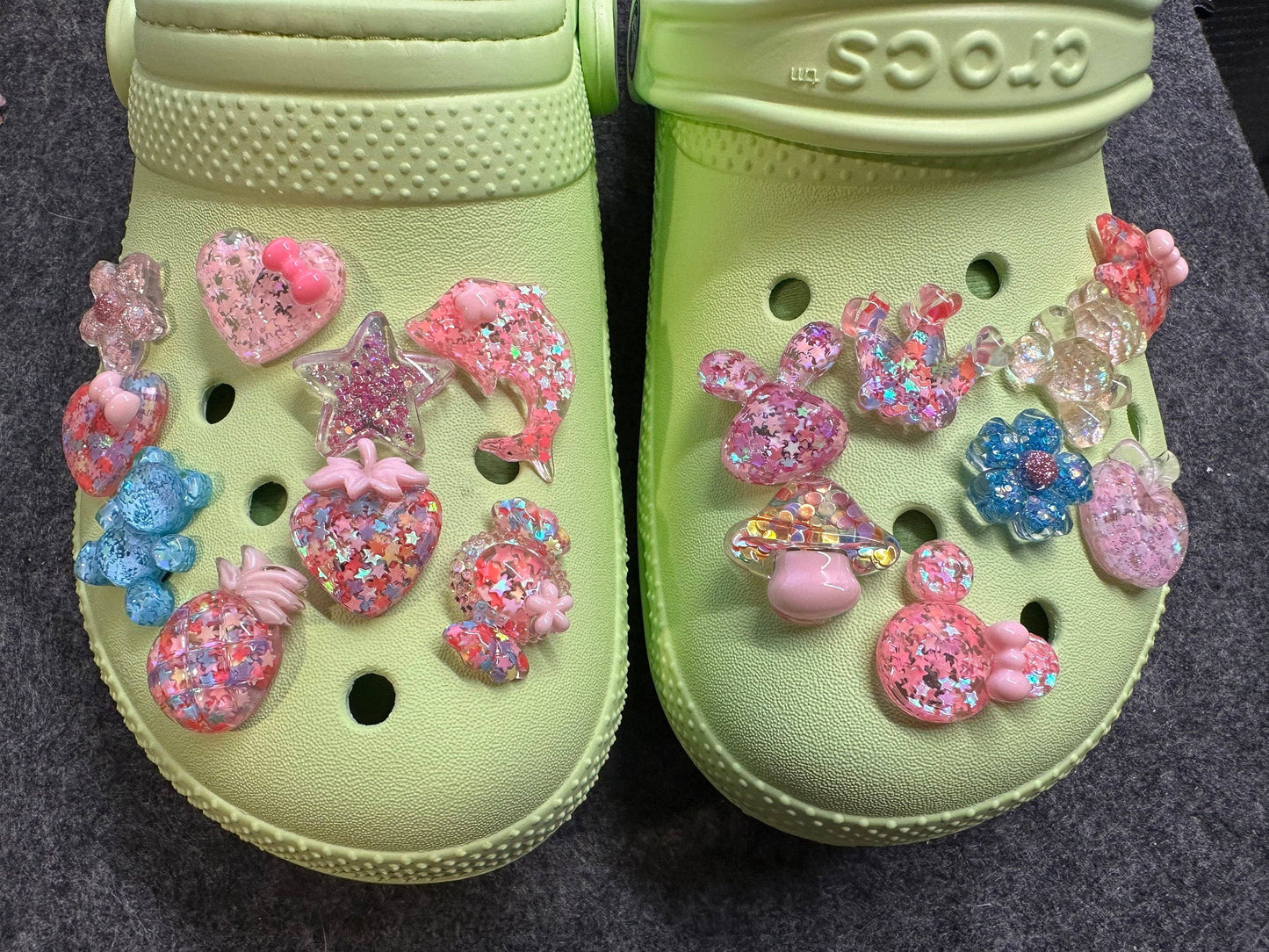 DIY croc charms laid out on a white background