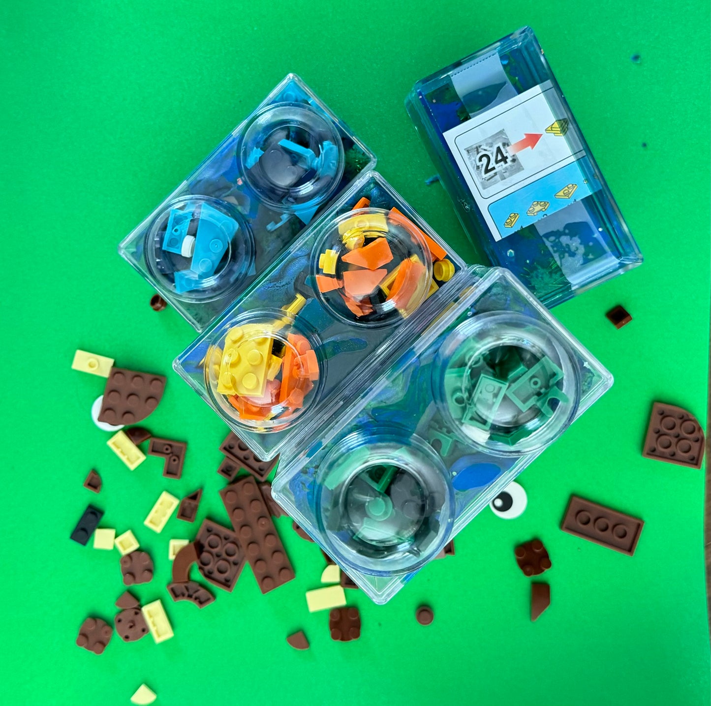 Building Block Robot Sensory Kit featuring handmade blue/green glitter dough, building blocks, and sensory toys. Designed for sensory exploration, creative play, and fine motor skill development, this kit provides a magical, hands-on experience for kids ages 3 and up.