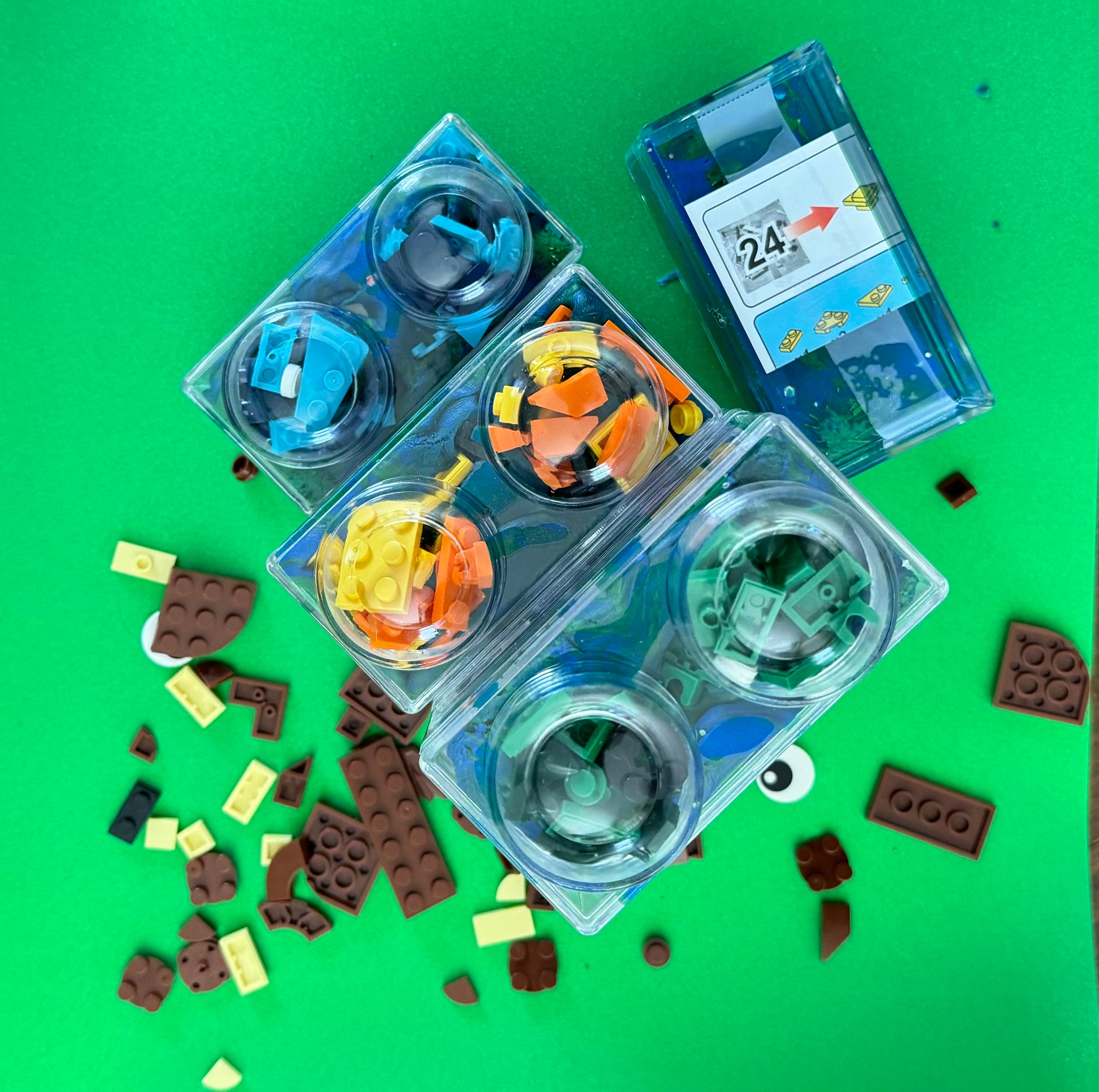 Building Block Robot Sensory Kit featuring handmade blue/green glitter dough, building blocks, and sensory toys. Designed for sensory exploration, creative play, and fine motor skill development, this kit provides a magical, hands-on experience for kids ages 3 and up.