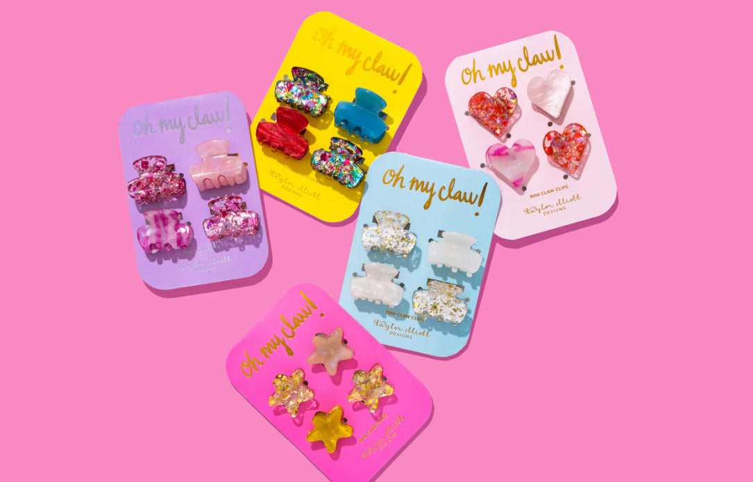 Set of 4 mini hair clips, each measuring 1.25 inches, ideal for stylish half-up hairstyles or adding a cute touch to any outfit. Includes 2 pink confetti clips and 2 pink acetate acid clips, presented on a 3.5" x 6.25" backer card with a gold ric rac ribbon hanger.