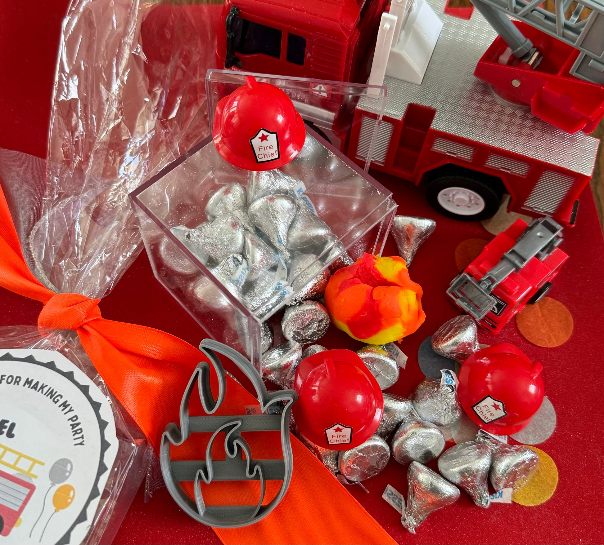 Exciting firefighter-themed sensory kit for kids aged 3 and up, including natural homemade play dough, dough molds, and miniature fire safety toys for imaginative play.