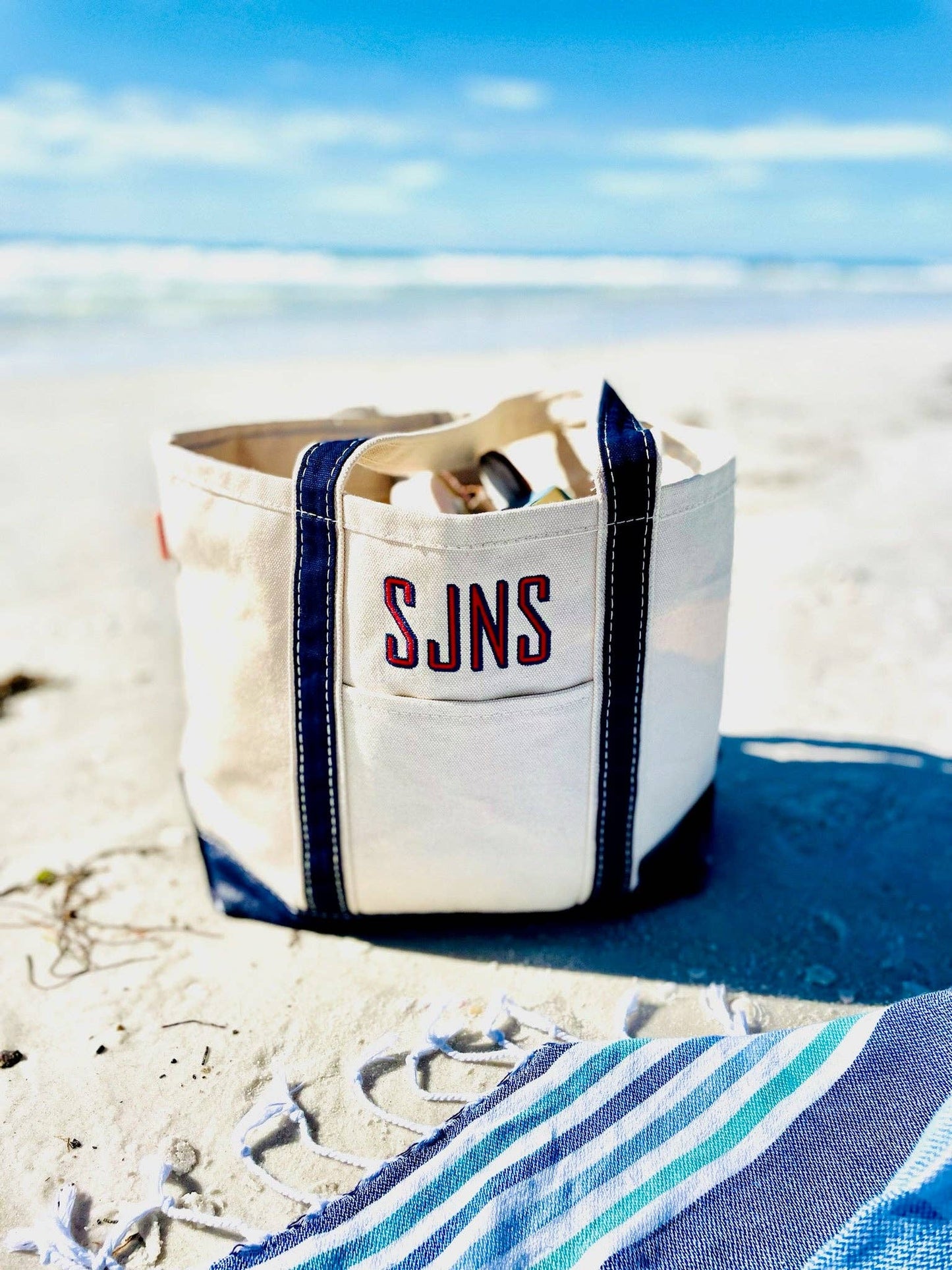 Classic boat tote bag with zip top, durable cotton canvas, roomy in hot pink, navy, coral