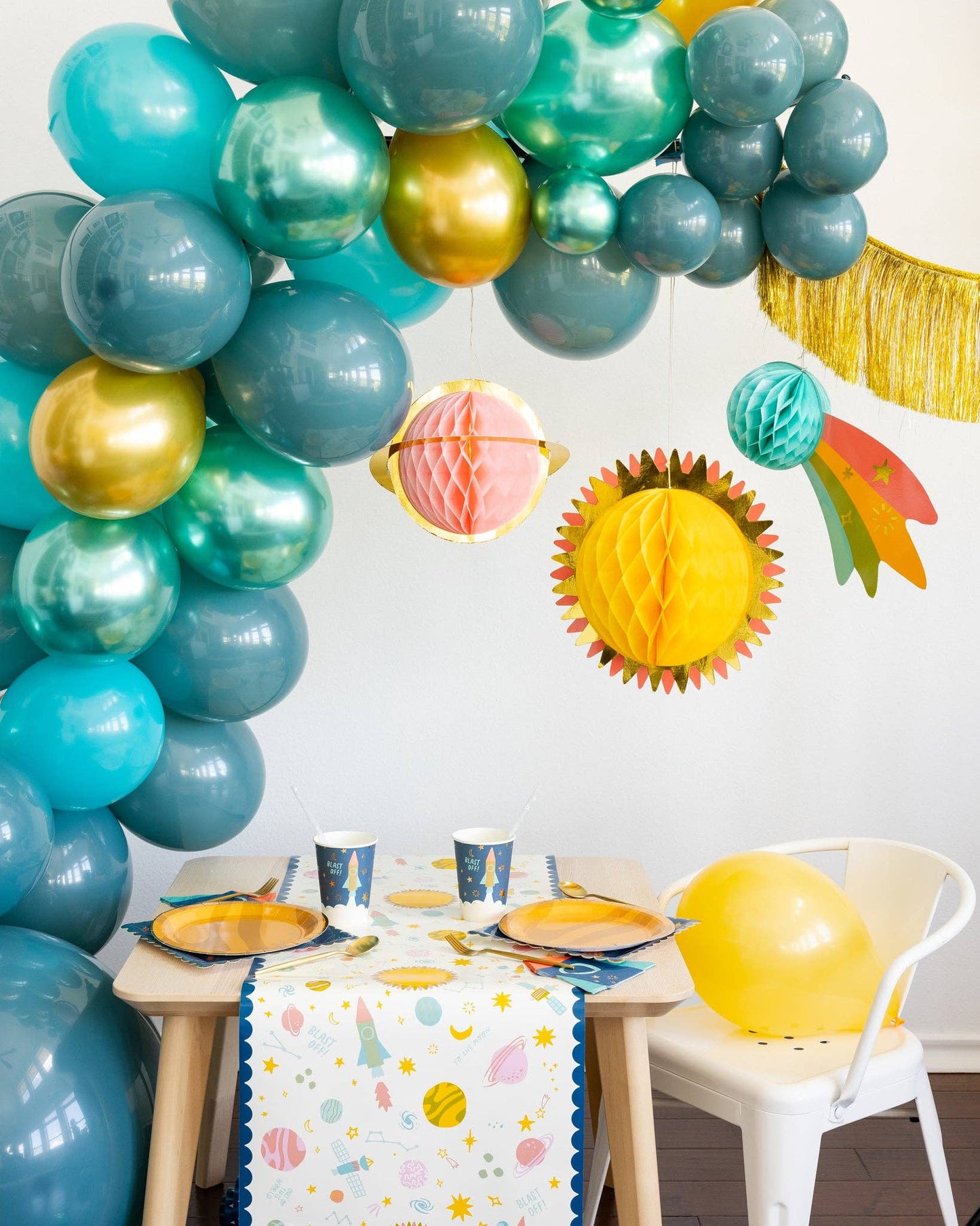 Honeycomb paper planets for space party, set of 3 with gold foil and cardboard backing."