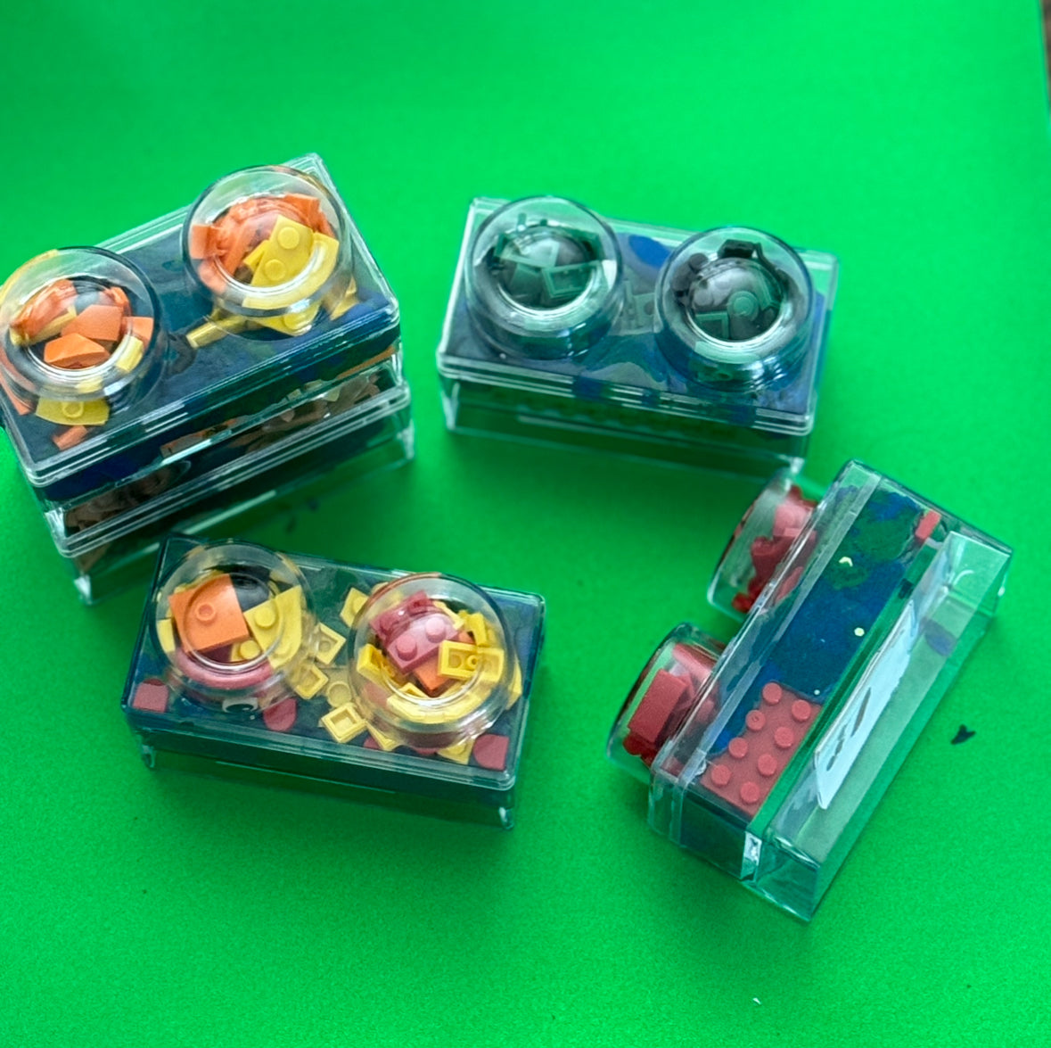 Building Block Robot Sensory Kit featuring handmade blue/green glitter dough, building blocks, and sensory toys. Designed for sensory exploration, creative play, and fine motor skill development, this kit provides a magical, hands-on experience for kids ages 3 and up.