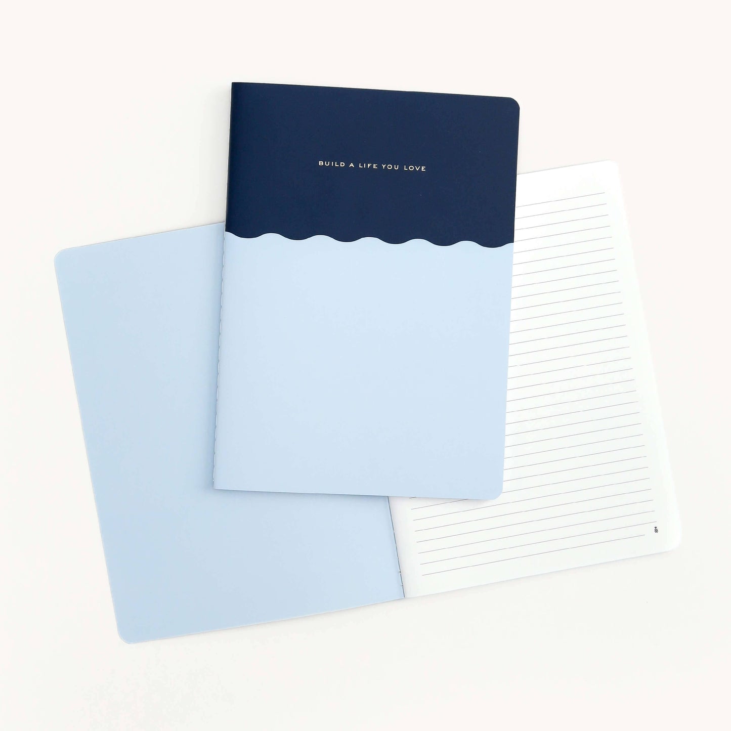 Stylish 6.5" x 9" notebook featuring "Build A Life You Love" in gold foil with saddle-stitched binding.