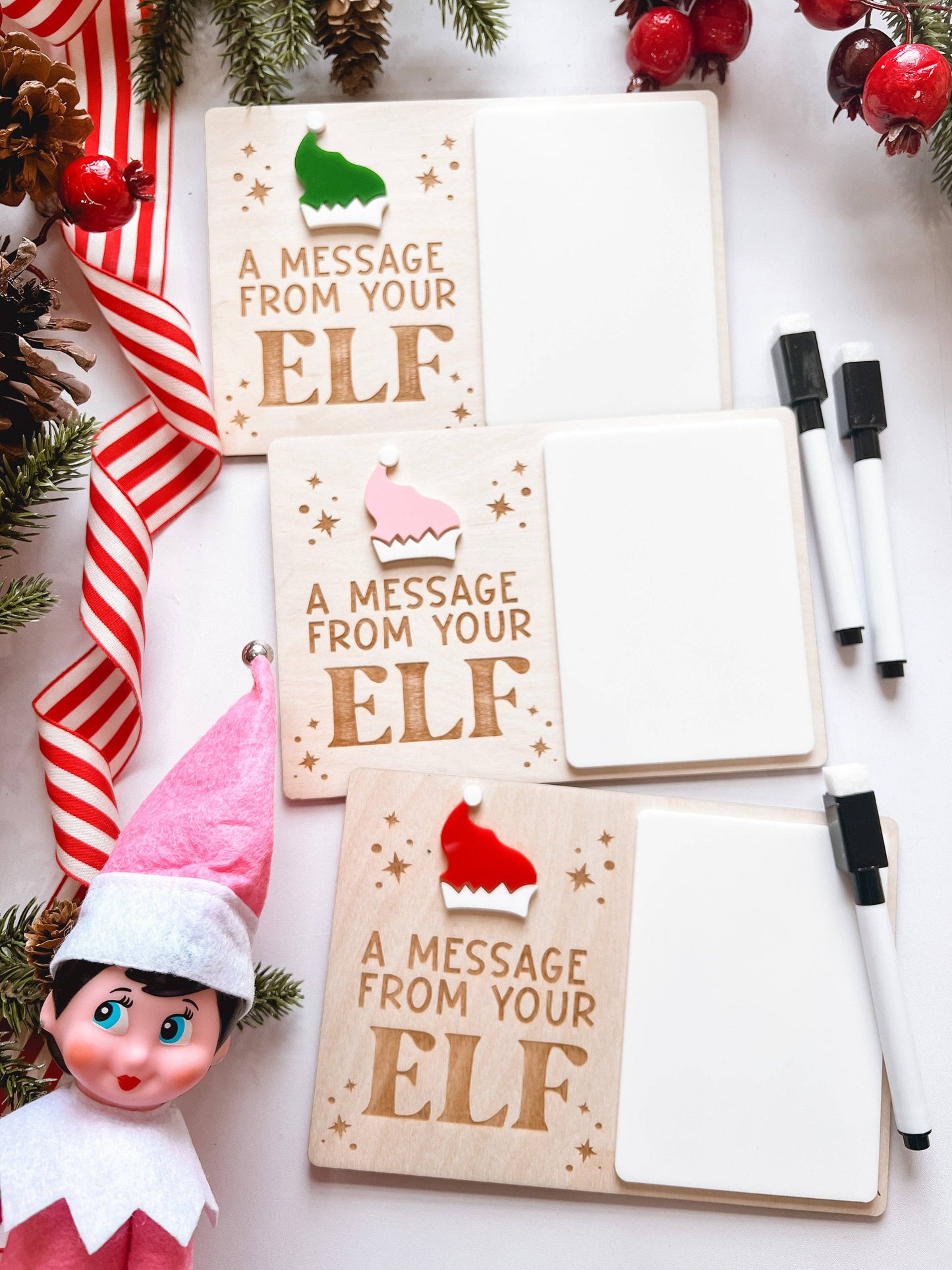 Elf on the Shelf holding message sign