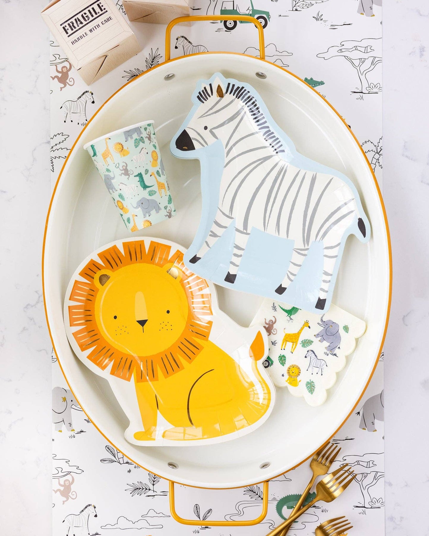 Lion-shaped paper party plates featuring a golden mane with shimmering gold foil accents, perfect for safari or jungle-themed birthday celebrations. Includes 8 plates, approximately 9" wide and 11" tall.