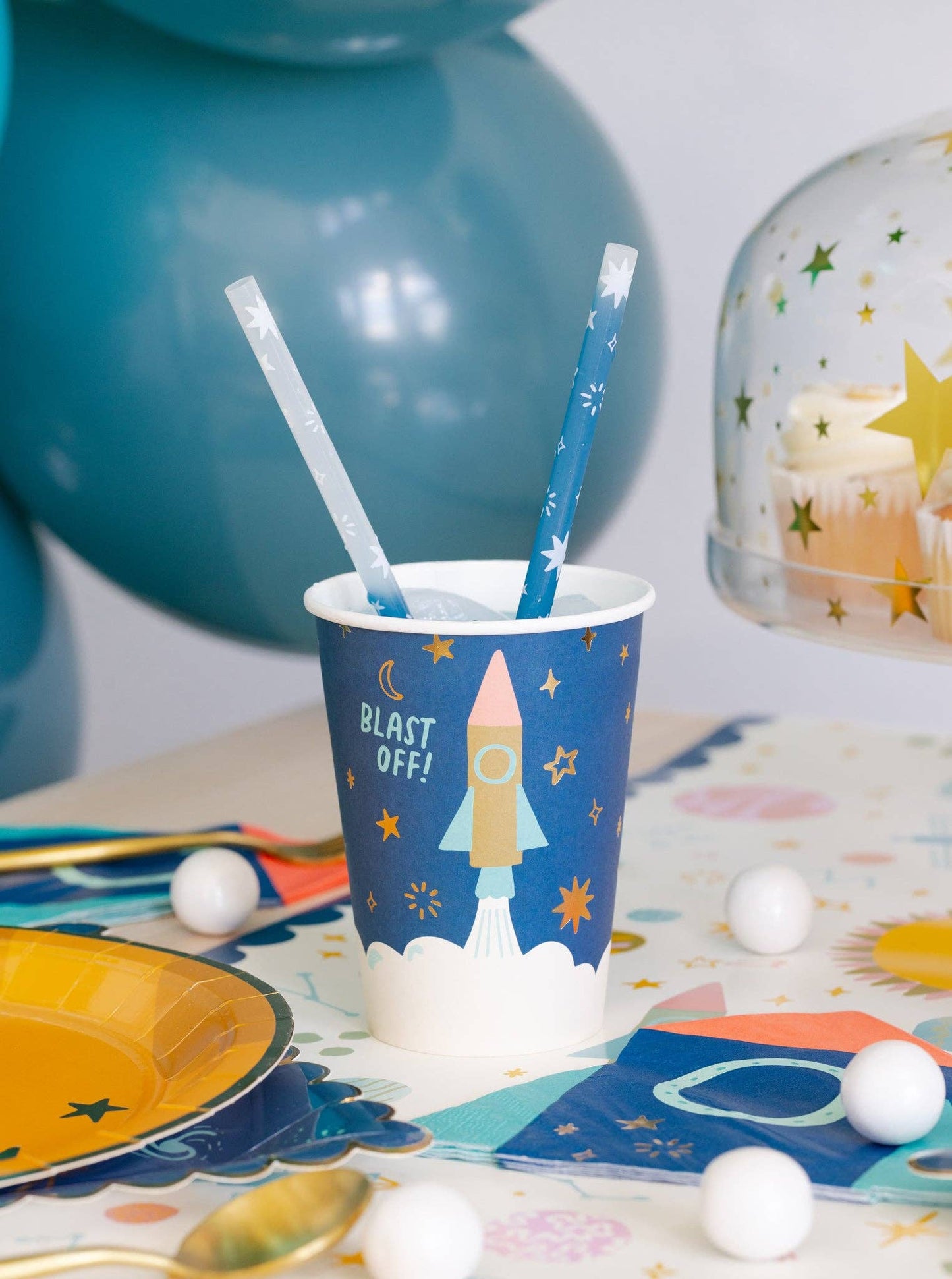 Outer space 12 oz paper cups with gold foil, 8 per pack, ideal for cosmic birthday parties.