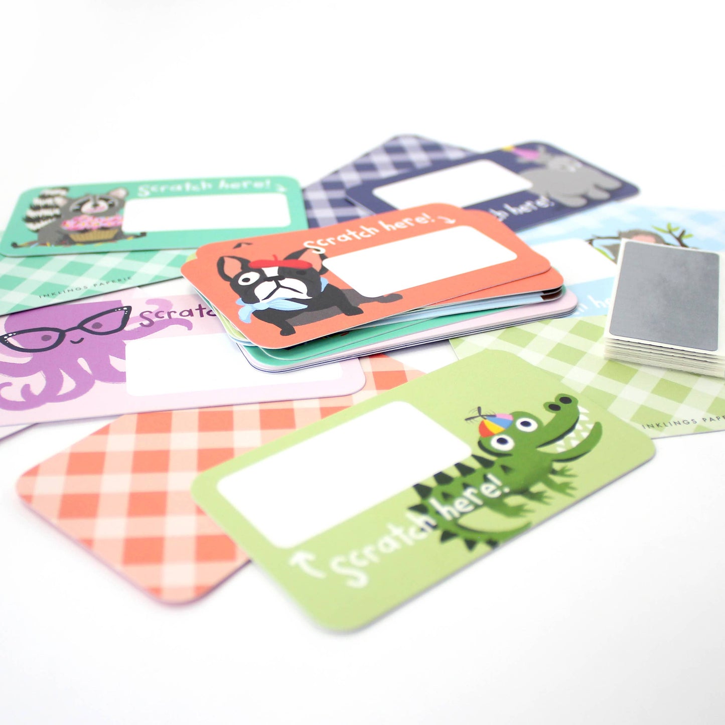 Set of 24 assorted scratch-off lunchbox notes measuring 2” x 3.5”, featuring six different animated animal friends designs. Each card allows you to write a personalized message in the blank space, which is then covered with a scratch-off sticker for a fun reveal. Perfect for slipping into lunch bags or coat pockets, these tiny notes come packaged in a clear plastic box, making them an ideal surprise for someone special.