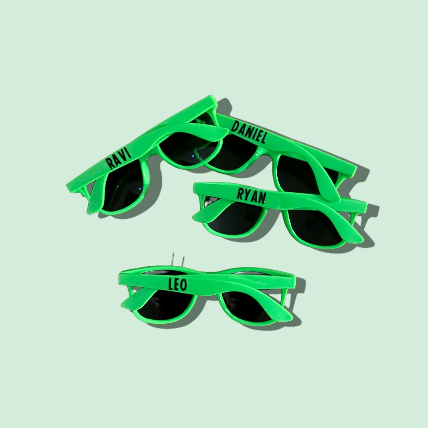 Personalized sunglasses party favors in fun colors for weddings and birthday squads.