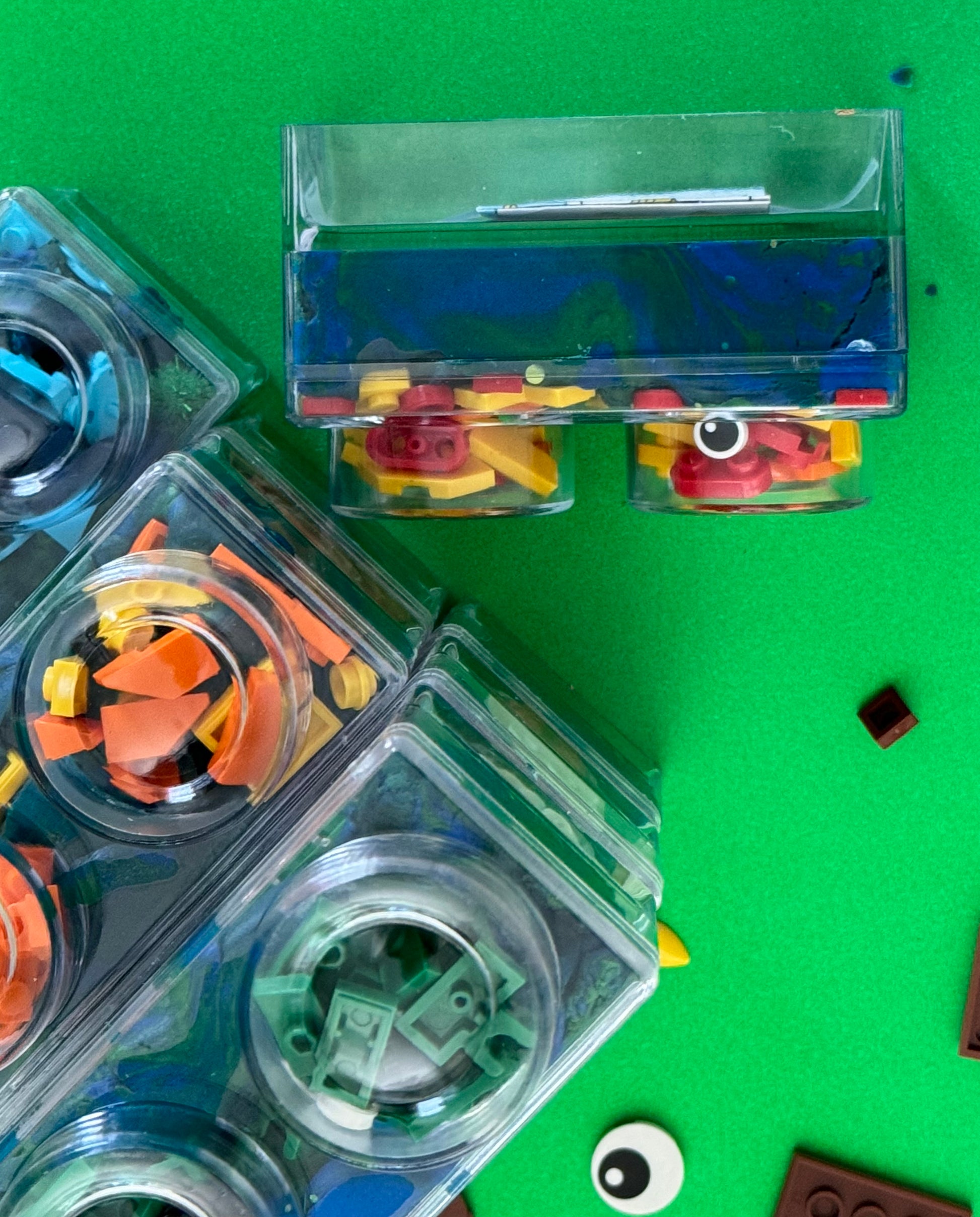 Building Block Robot Sensory Kit featuring handmade blue/green glitter dough, building blocks, and sensory toys. Designed for sensory exploration, creative play, and fine motor skill development, this kit provides a magical, hands-on experience for kids ages 3 and up.