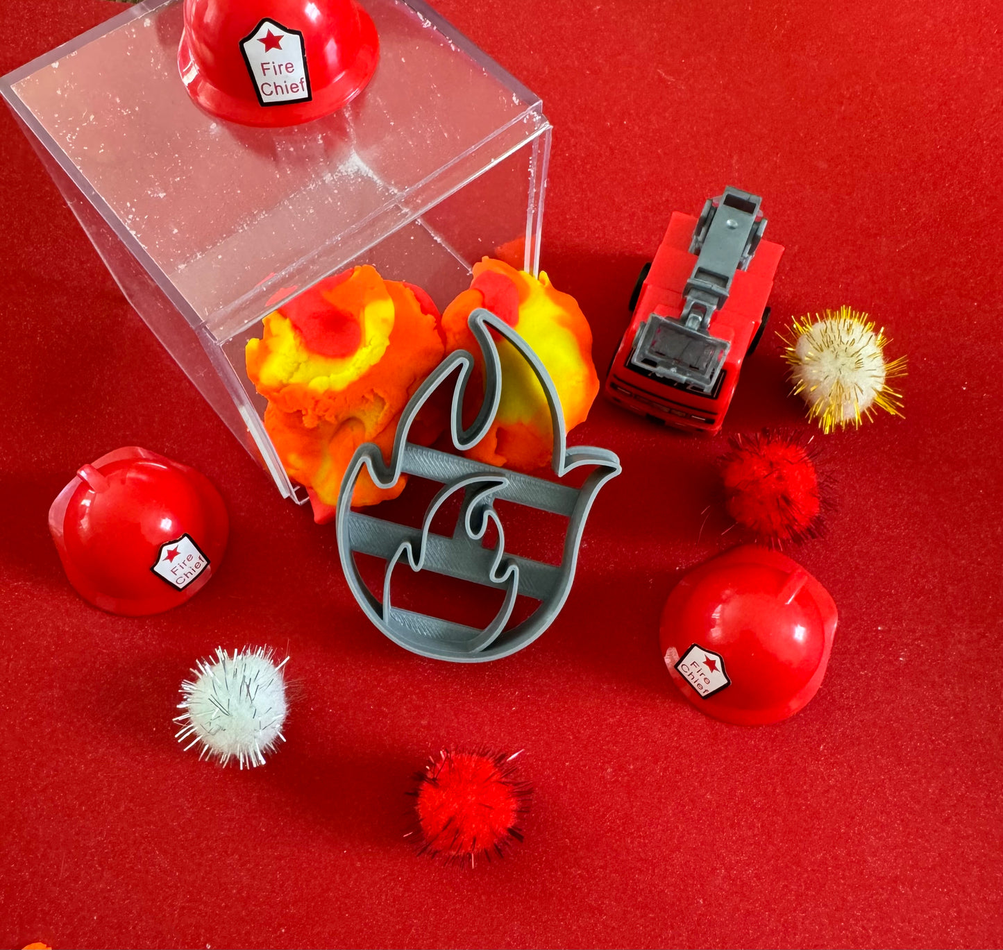 Exciting firefighter-themed sensory kit for kids aged 3 and up, including natural homemade play dough, dough molds, and miniature fire safety toys for imaginative play.