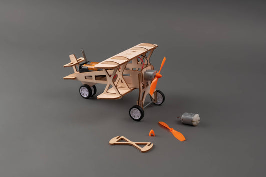 Kids building propeller plane from DIY STEM kit