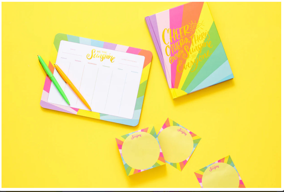 A stylish weekly planner and mousepad combo sized 7" x 9", featuring 52 sheets for organizing daily and weekly to-do lists. Each sheet is adorned with elegant gold foil imprinting, and the planner is shrink-wrapped for protection. Imported for quality.