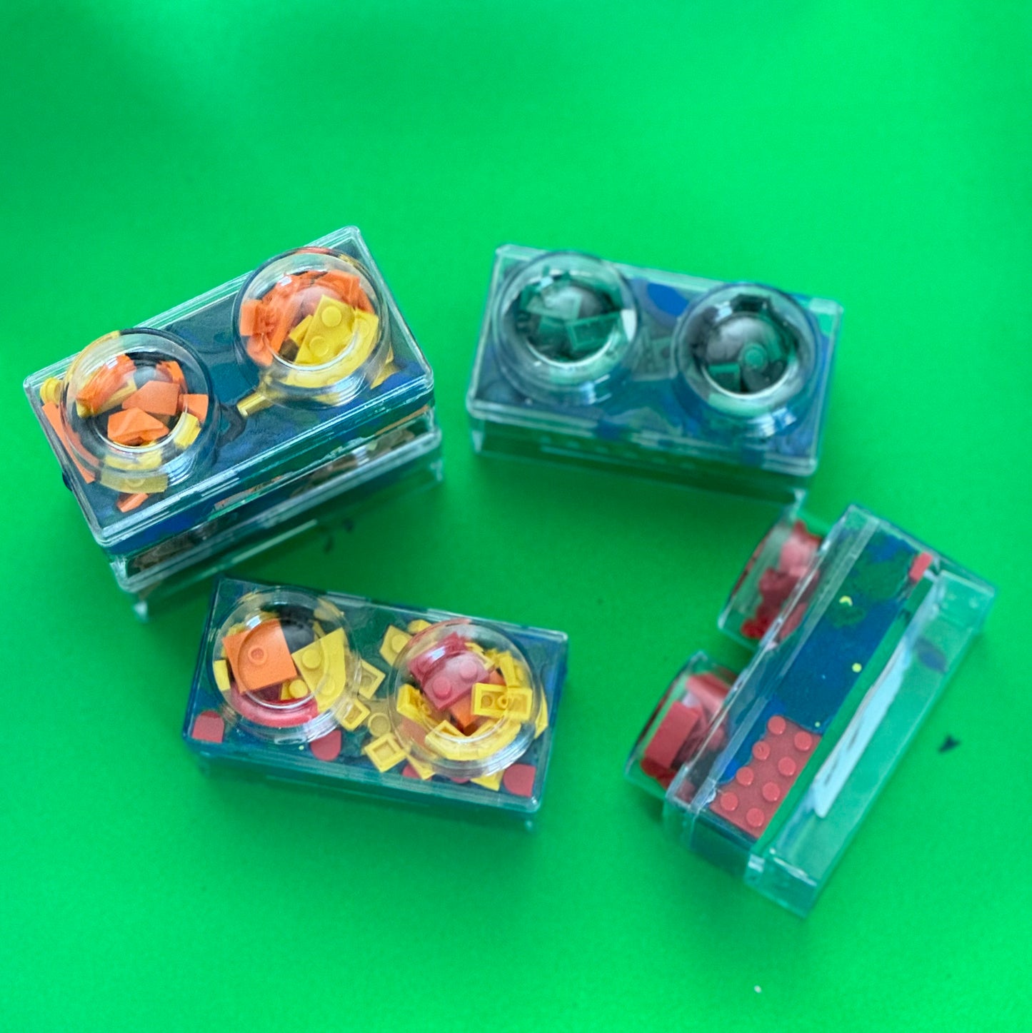 Building Block Robot Sensory Kit featuring handmade blue/green glitter dough, building blocks, and sensory toys. Designed for sensory exploration, creative play, and fine motor skill development, this kit provides a magical, hands-on experience for kids ages 3 and up.