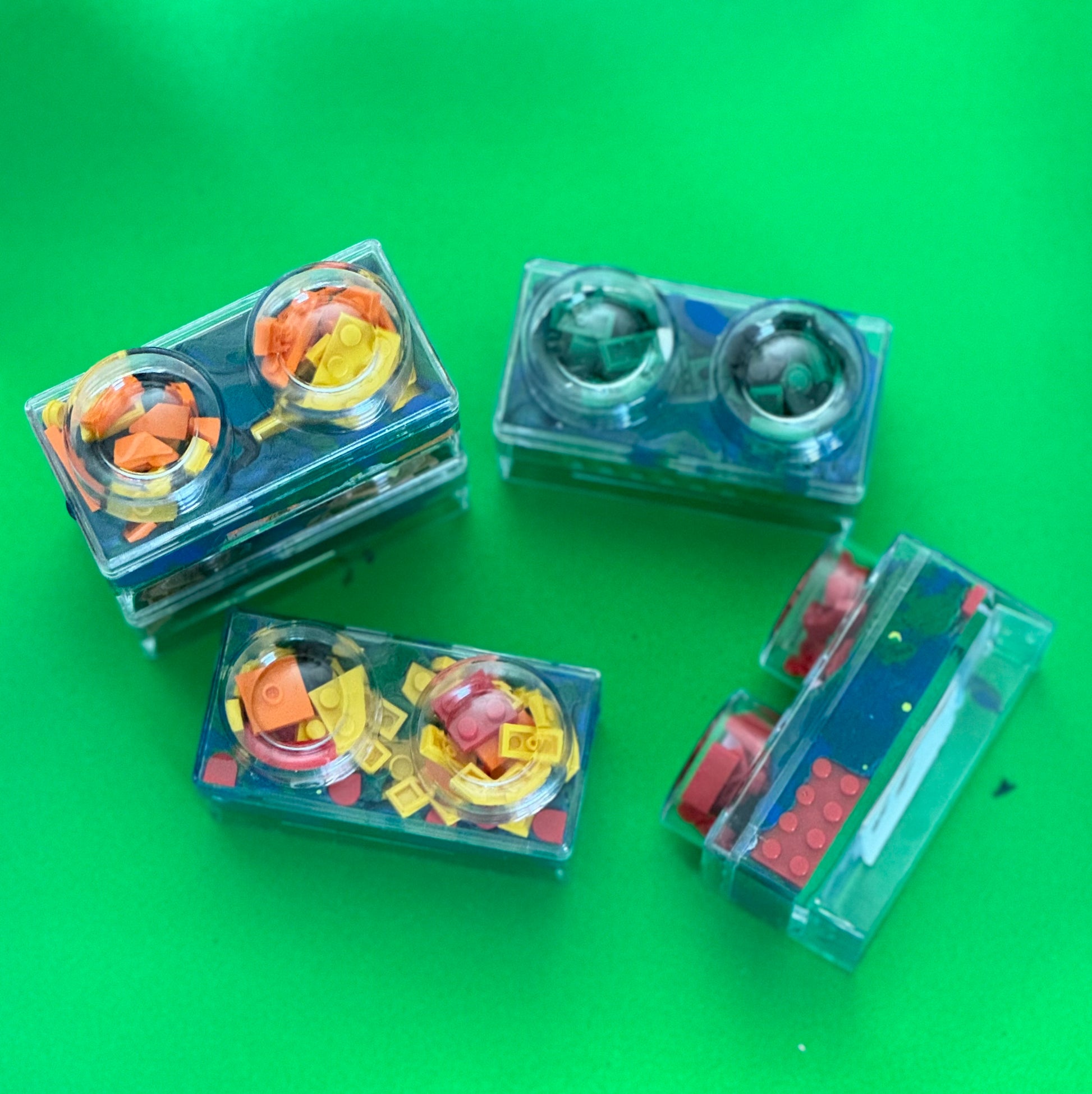 Building Block Robot Sensory Kit featuring handmade blue/green glitter dough, building blocks, and sensory toys. Designed for sensory exploration, creative play, and fine motor skill development, this kit provides a magical, hands-on experience for kids ages 3 and up.