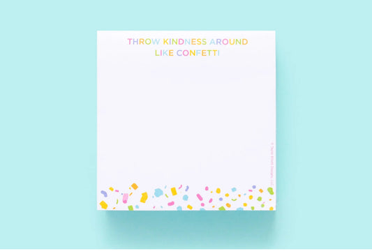 Colorful 3.5" x 3.5" sticky note pad with 300 sheets, imprinted with 'Throw Kindness Around Like Confetti.' Features a sticky adhesive backing and comes in shrink-wrap packaging. Confetti acrylic note holder sold separately.