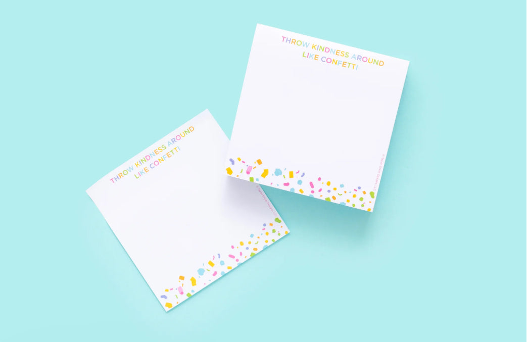 Colorful 3.5" x 3.5" sticky note pad with 300 sheets, imprinted with 'Throw Kindness Around Like Confetti.' Features a sticky adhesive backing and comes in shrink-wrap packaging. Confetti acrylic note holder sold separately.