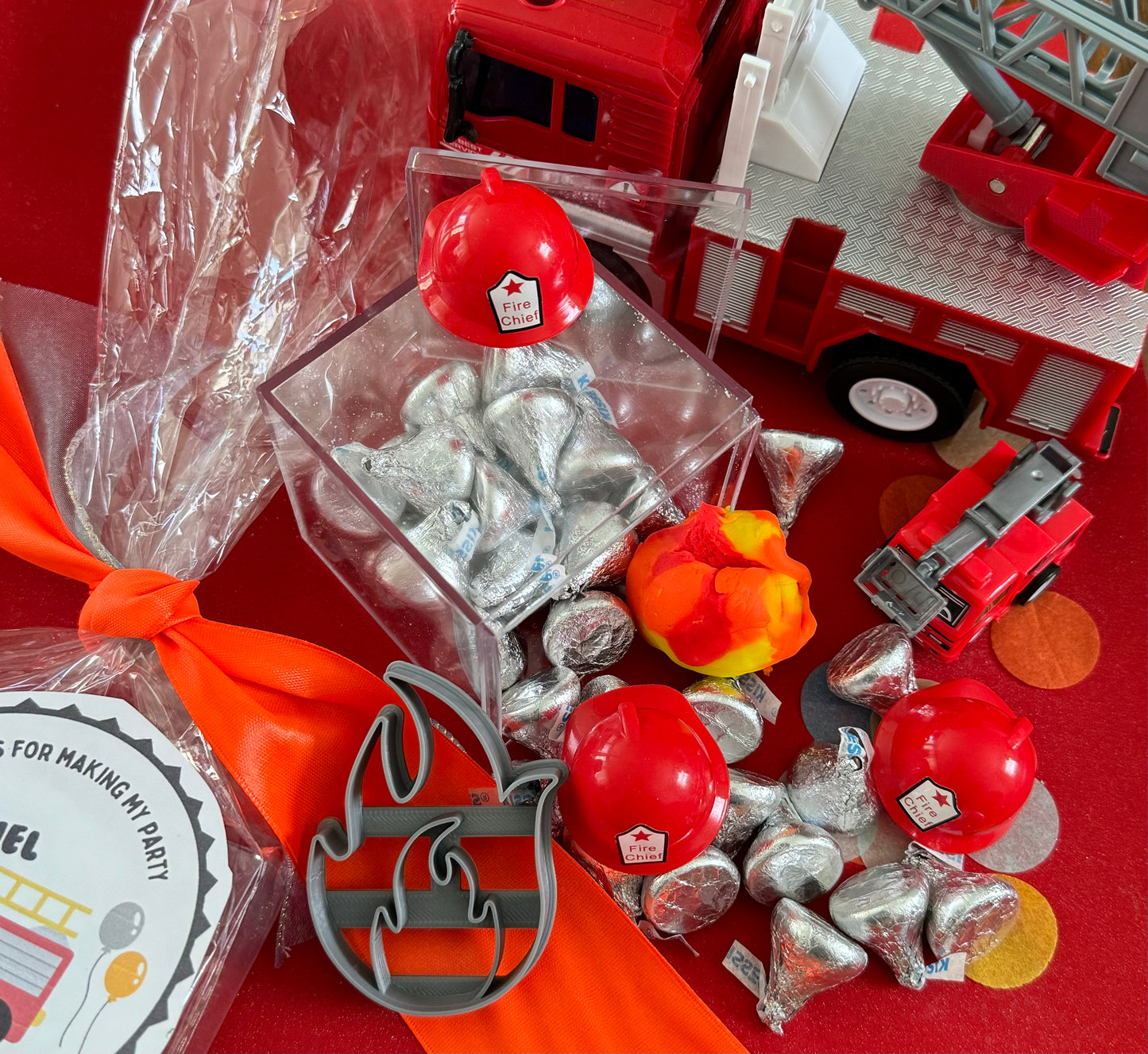 Exciting firefighter-themed sensory kit for kids aged 3 and up, including natural homemade play dough, dough molds, and miniature fire safety toys for imaginative play.