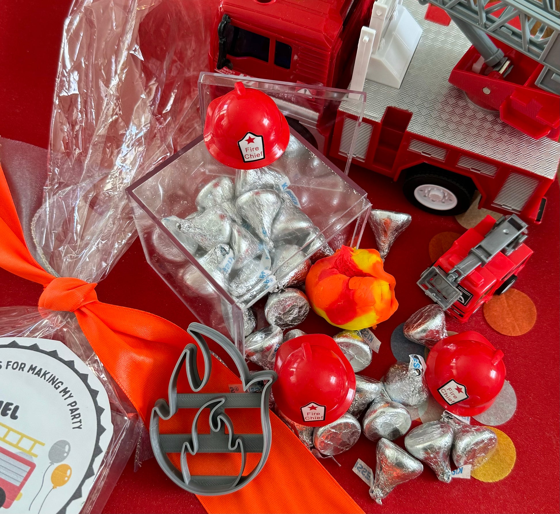 Exciting firefighter-themed sensory kit for kids aged 3 and up, including natural homemade play dough, dough molds, and miniature fire safety toys for imaginative play.