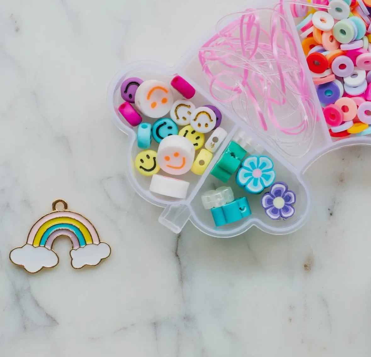 Handmade aquamarine mermaid kit by a women-owned small business, perfect for making unique jewelry with a variety of fun beads.