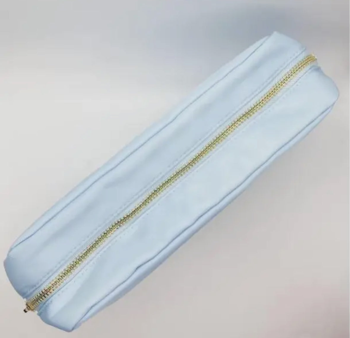 Personalized cosmetic pouch with zipper, featuring custom name, initials, or trendy icons. Lightweight and durable, available in neon or neutral colors with gold zippers. Size: 10" long x 5" wide x 3" deep. Perfect for summer slumber parties, travel, school, or as a makeup organizer. Great gift for girls, bridesmaids, or team members.