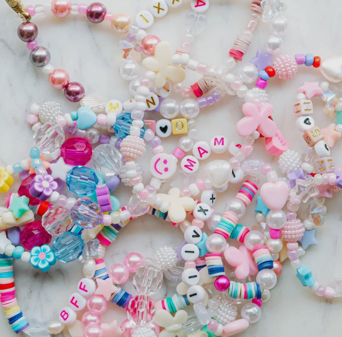 Handmade aquamarine mermaid kit by a women-owned small business, perfect for making unique jewelry with a variety of fun beads.