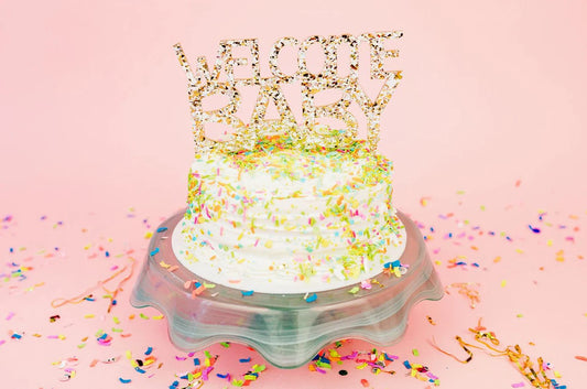 Set of 4 "Welcome Baby" cake toppers with confetti and sparkle, perfect for baby showers.