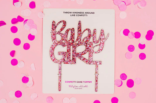 Set of 4 "Baby Girl" cake toppers in hot pink foil, perfect for baby showers and gender reveals.