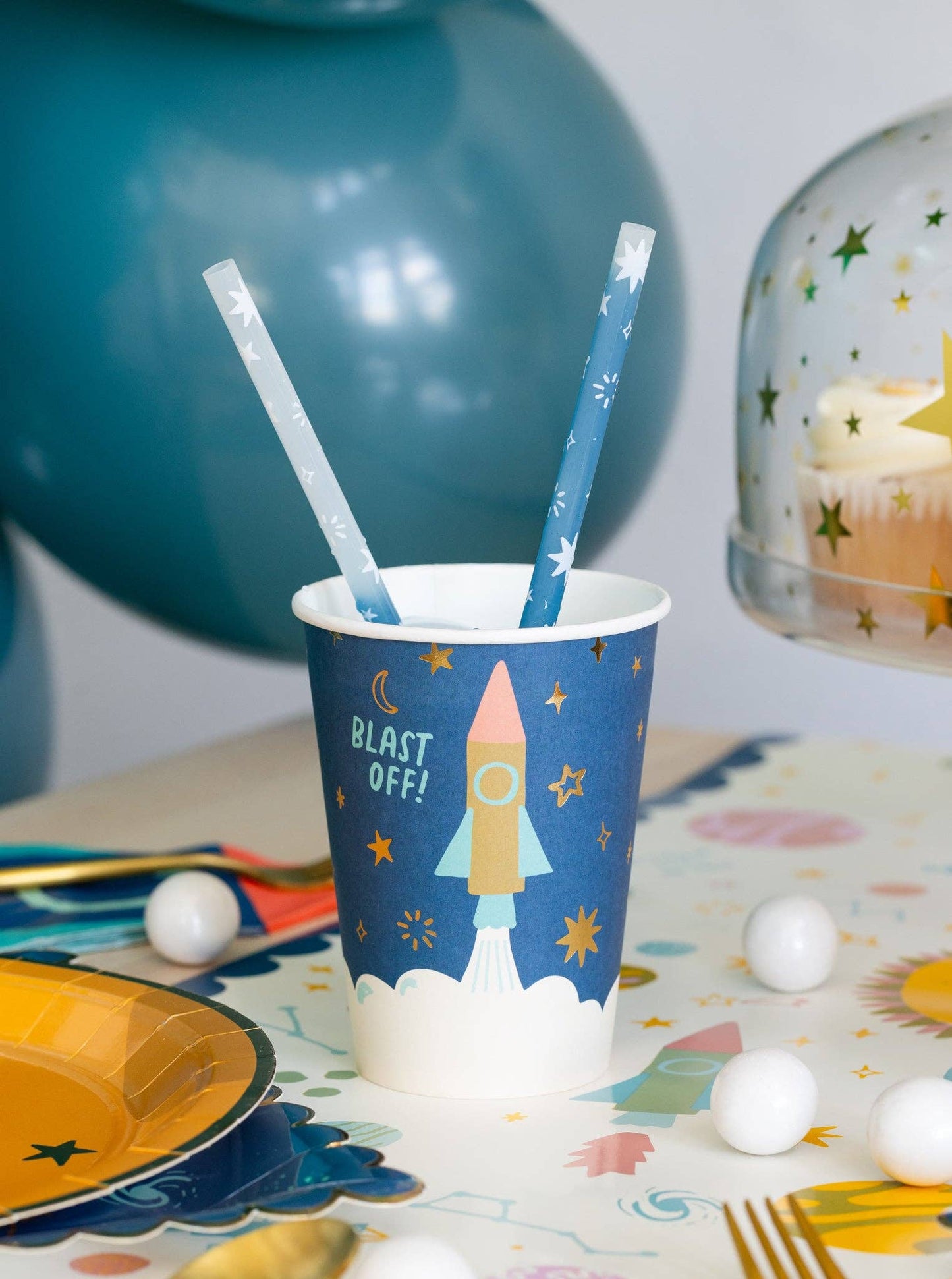 Fun space paper party cups, 12 oz with gold foil accents, perfect for galaxy-themed events.