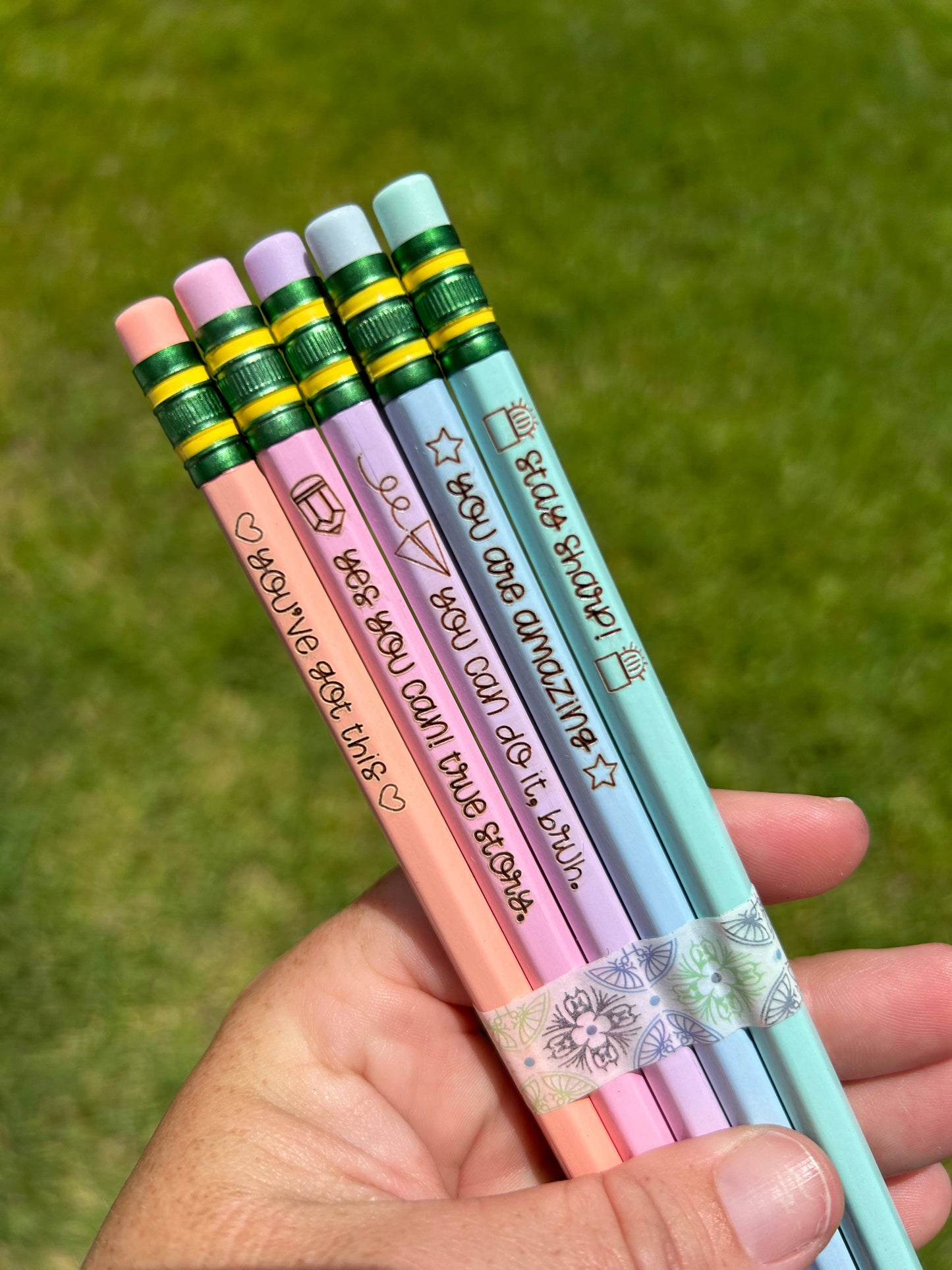 Set of 5 engraved pencils in pastel colors, featuring motivational phrases: "You are amazing," "Stay Sharp," "You can do it, bruh," "Yes you can! True story," and "You've got this." Ideal for back-to-school gifts.