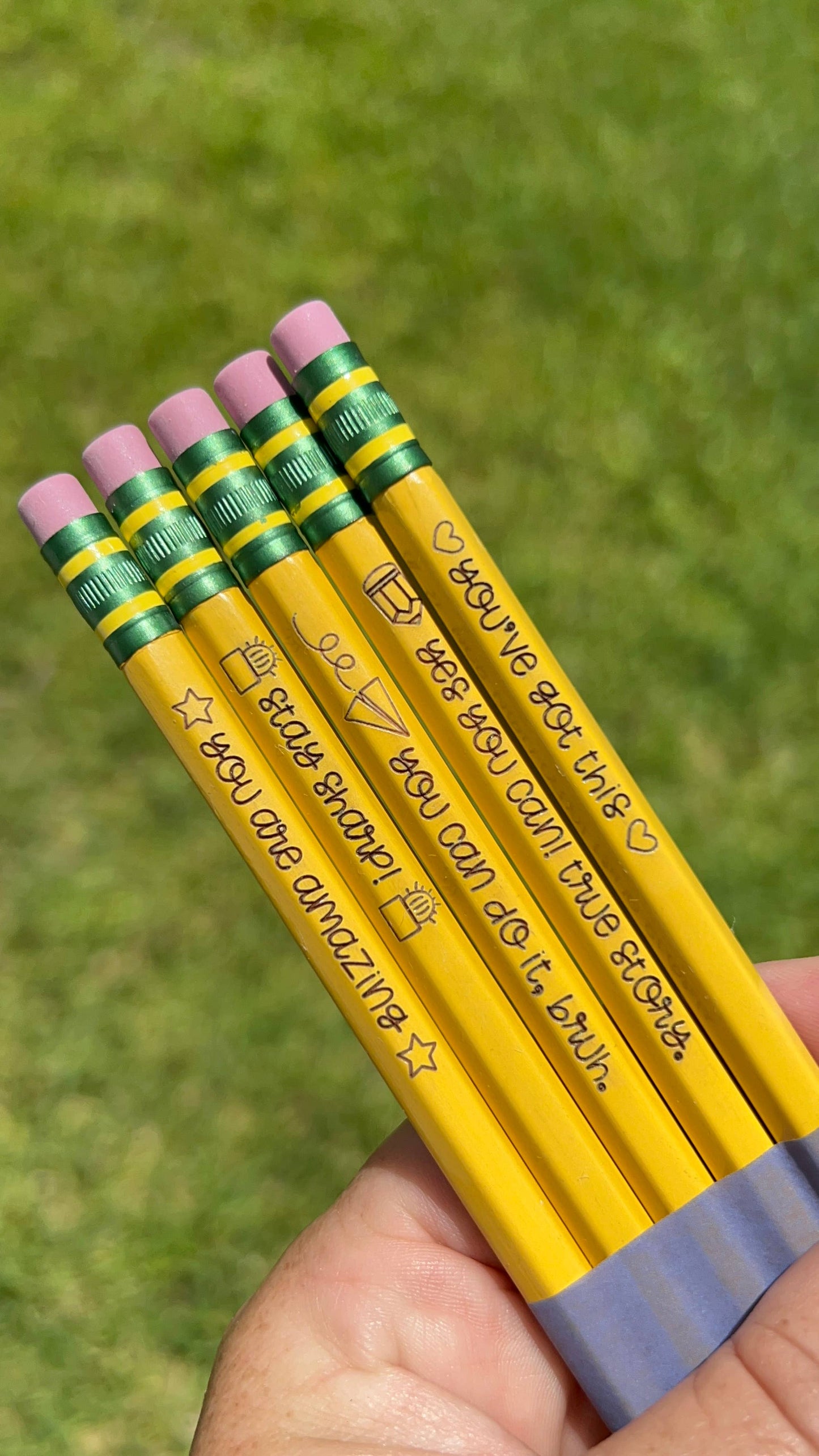 Set of 5 engraved pencils in pastel colors, featuring motivational phrases: "You are amazing," "Stay Sharp," "You can do it, bruh," "Yes you can! True story," and "You've got this." Ideal for back-to-school gifts.