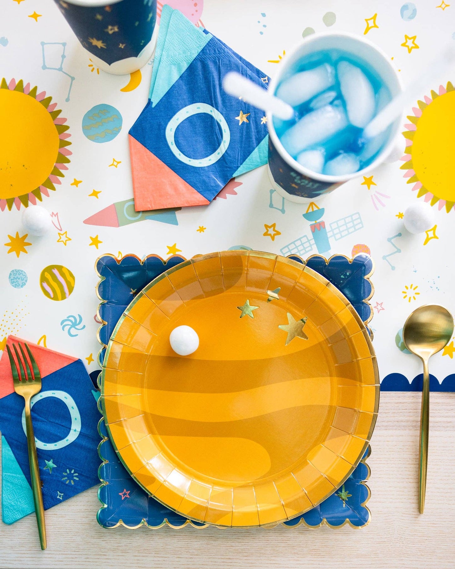 Set of 18 rocket-shaped paper napkins, 5” with gold foil, perfect for space adventure events.