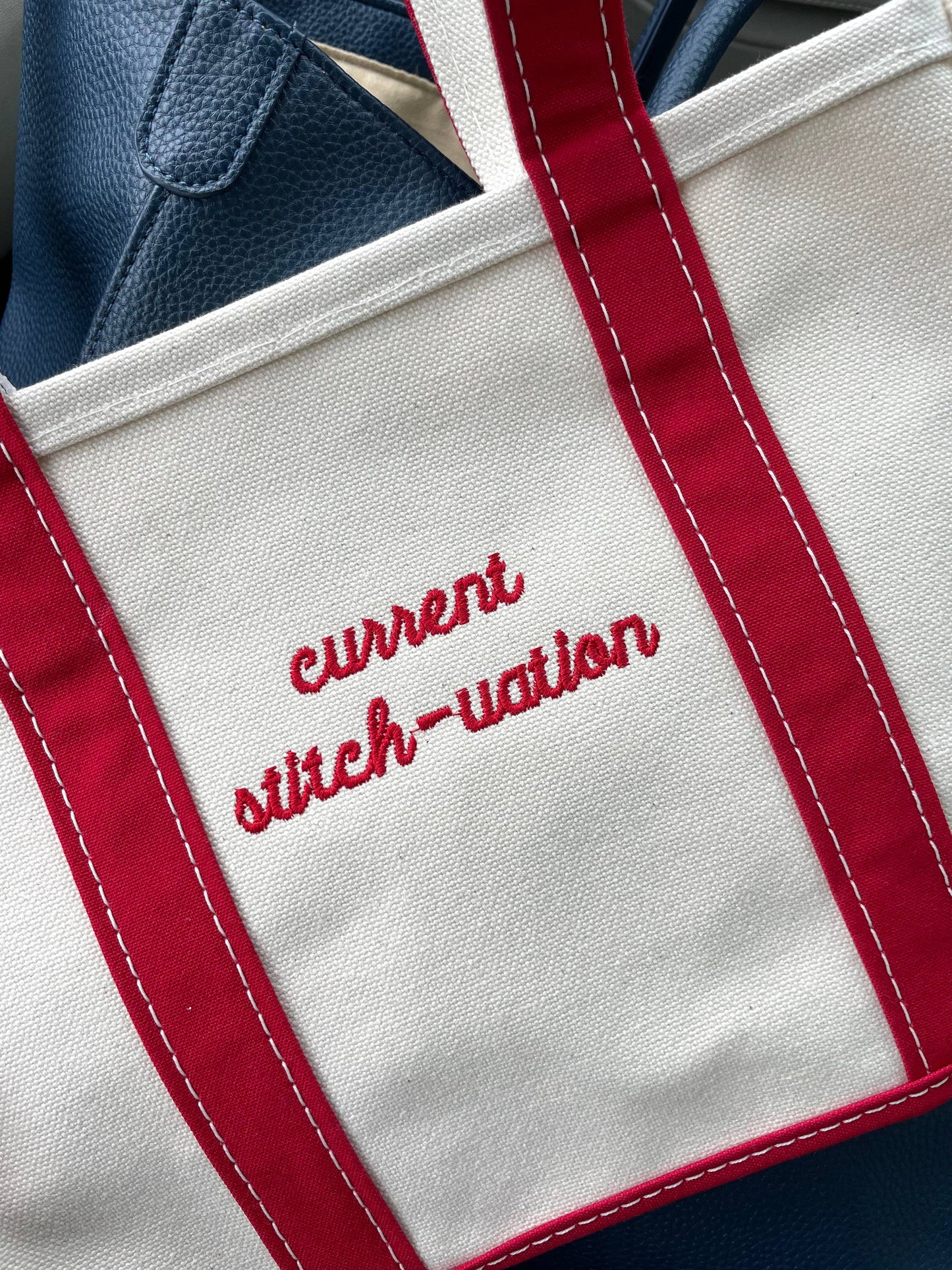 Monogrammed canvas boat tote, zippered top, exterior pocket, ideal for beach or pool days