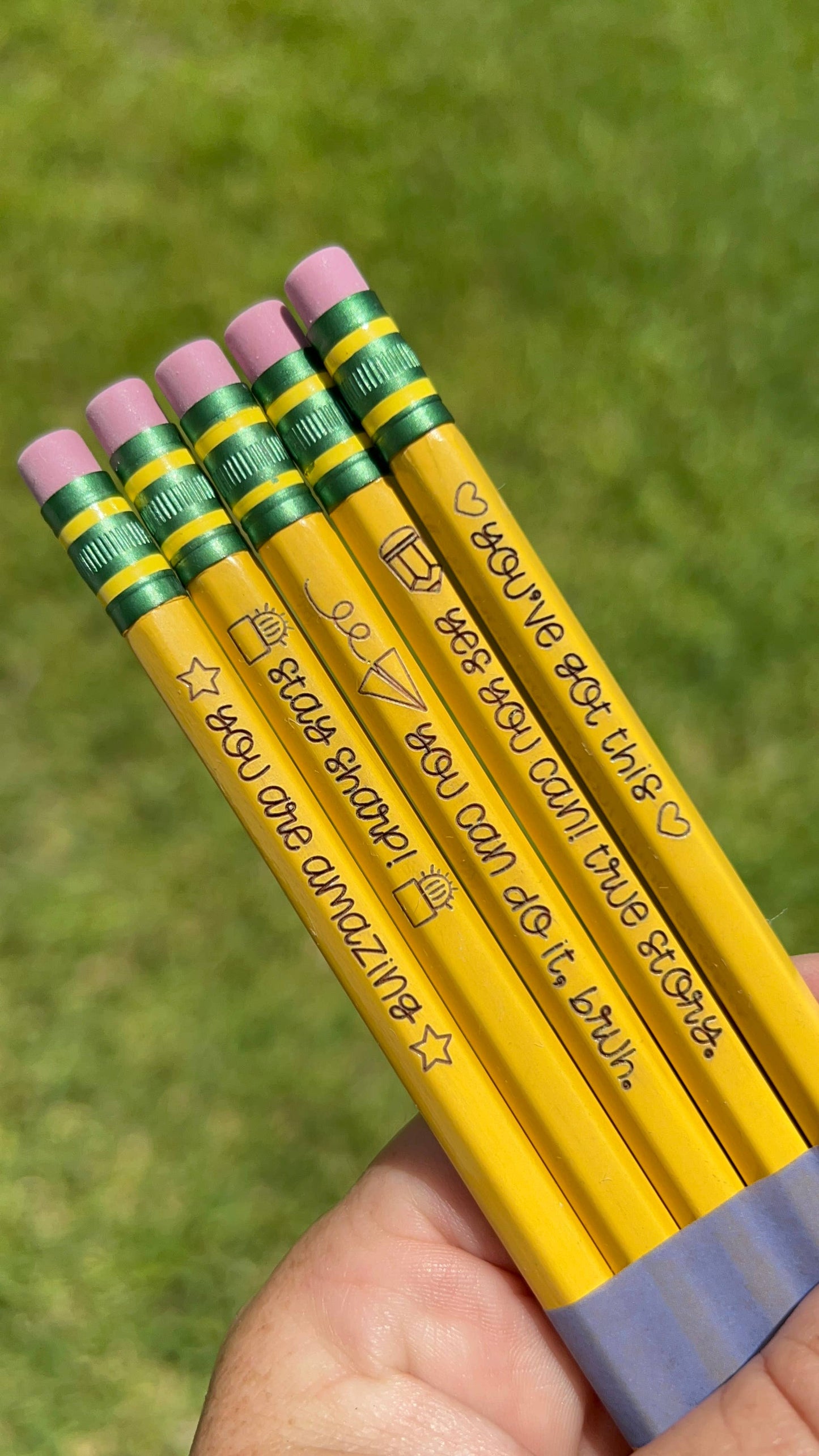Set of 5 engraved pencils in pastel colors, featuring motivational phrases: "You are amazing," "Stay Sharp," "You can do it, bruh," "Yes you can! True story," and "You've got this." Ideal for back-to-school gifts.