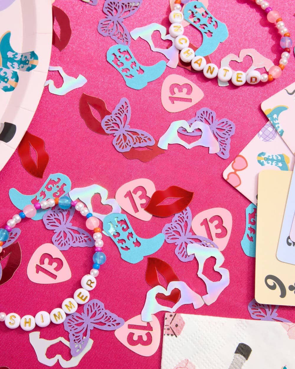 Glittery confetti mix with butterflies, boots, and lips