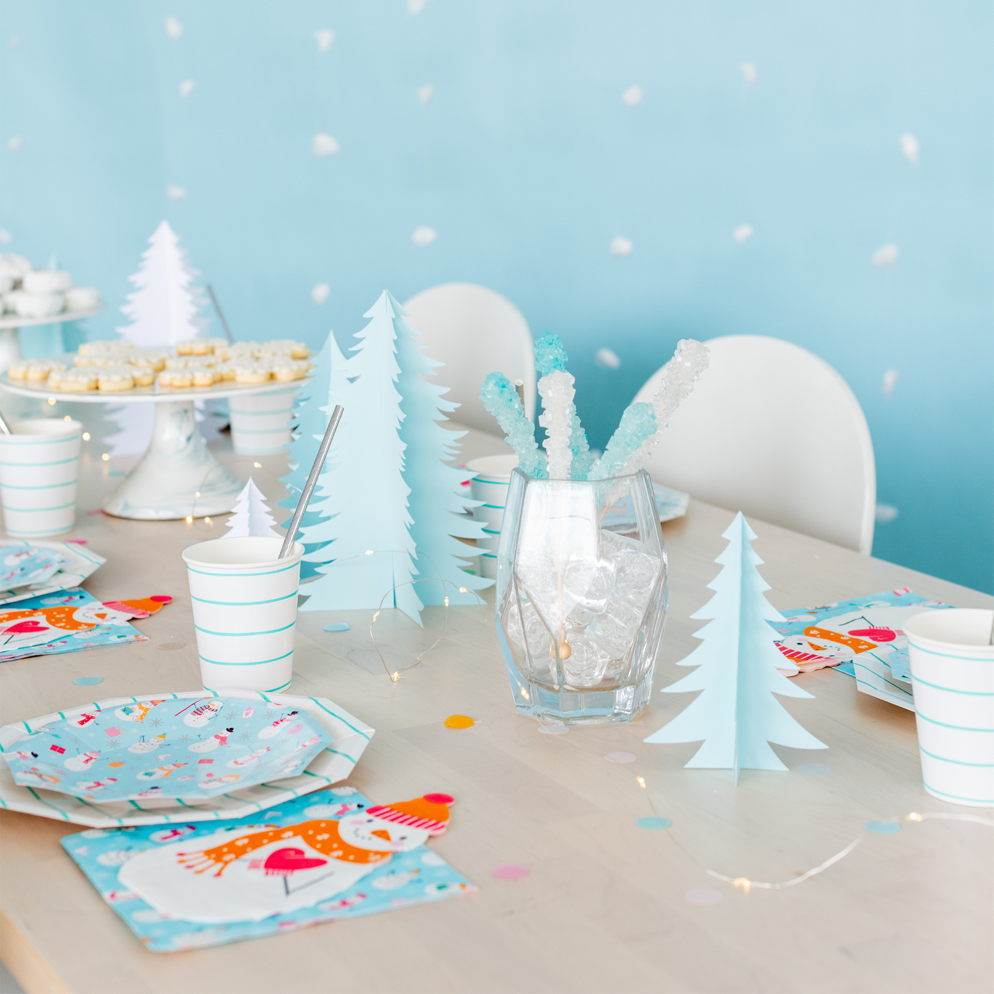 Winter-themed kids tattoos with snowmen and shiny silver details