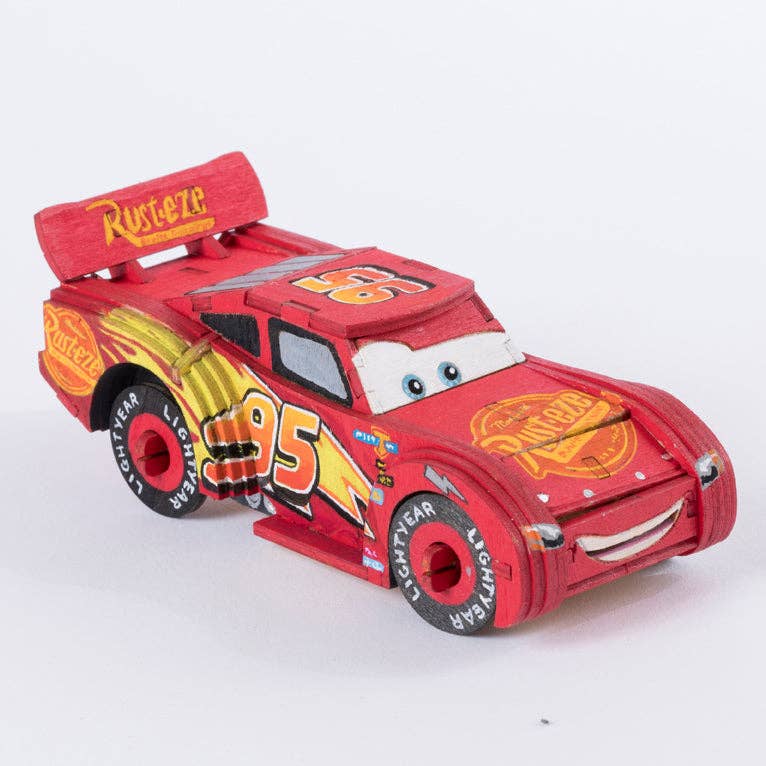 Red toy car with flame design and '95' on a white background