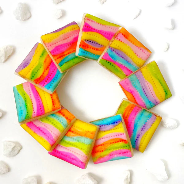 Vegan rainbow matzah tiles – Marzipops hand-painted, gluten-free treats for a colorful Seder.
