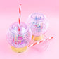 Shake up your holiday drinks with this 12 oz snow globe-shaped cup, featuring a holiday village and shakeable confetti. Perfect for festive parties or as a unique gift. BPA-free and hand wash only. Dimensions: 10.5" x 5" x 5" (including straw).