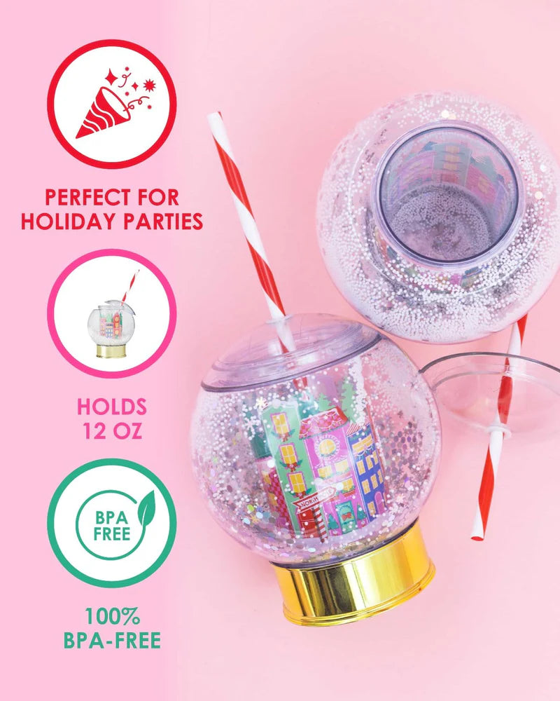 Shake up your holiday drinks with this 12 oz snow globe-shaped cup, featuring a holiday village and shakeable confetti. Perfect for festive parties or as a unique gift. BPA-free and hand wash only. Dimensions: 10.5" x 5" x 5" (including straw).