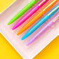 Set of 5 colorful "Best Teacher Ever" pens with matching ink colors. Medium ballpoint pens in a white gift box with gold foil dots, perfect for teacher appreciation gifts.